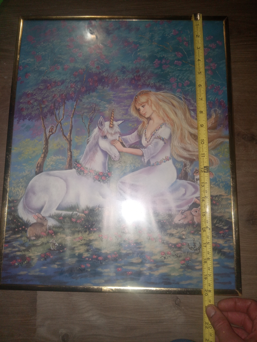 framed artwork is a print titled "Girl and Unicorn" by artist Judy Mastrangelo.